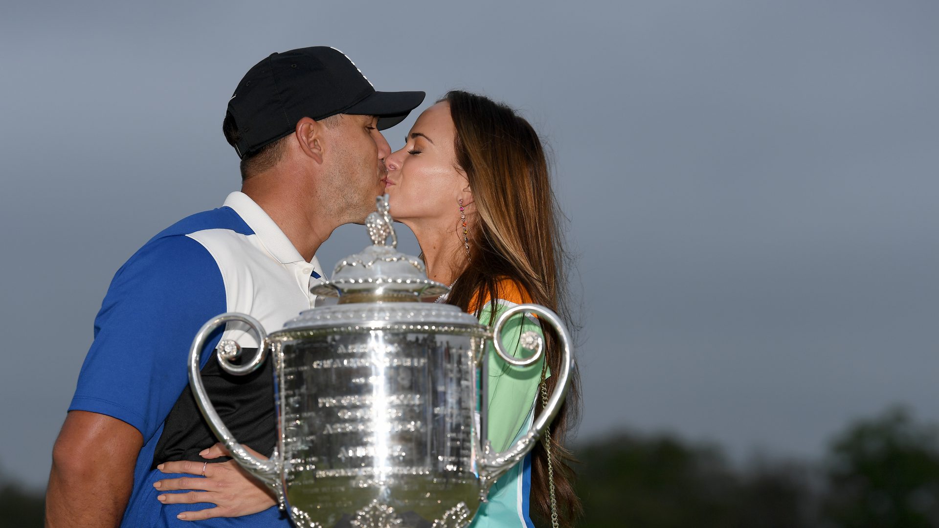 FARMINGDALE, NEW YORK - MAY 19: Brooks Koepka of the United States poses with girlfriend Jena Sims and the Wanamaker Trophy during the Trophy Presentation Ceremony after winning the final round of the 2019 PGA Championship at the Bethpage Black course on May 19, 2019 in Farmingdale, New York. (Photo by Stuart Franklin/Getty Images)