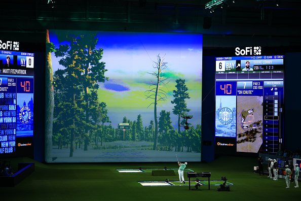 PALM BEACH GARDENS, FLORIDA - JANUARY 07: Shane Lowry of The Bay Golf Club plays a shot on the seventh hole during their TGL presented by SoFi match against the New York Golf Club at SoFi Center on January 07, 2025 in Palm Beach Gardens, Florida. (Photo by Mike Ehrmann/TGL/TGL Golf via Getty Images)